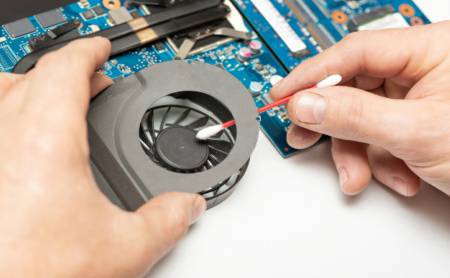 clean a laptop fan with the use of cotton bud