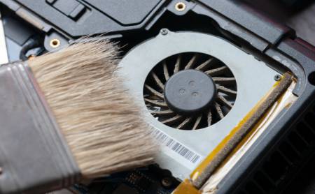 clean a laptop fan without the use of compressed air