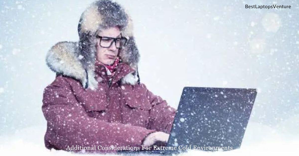 A man in extreme cold weather with a laptop