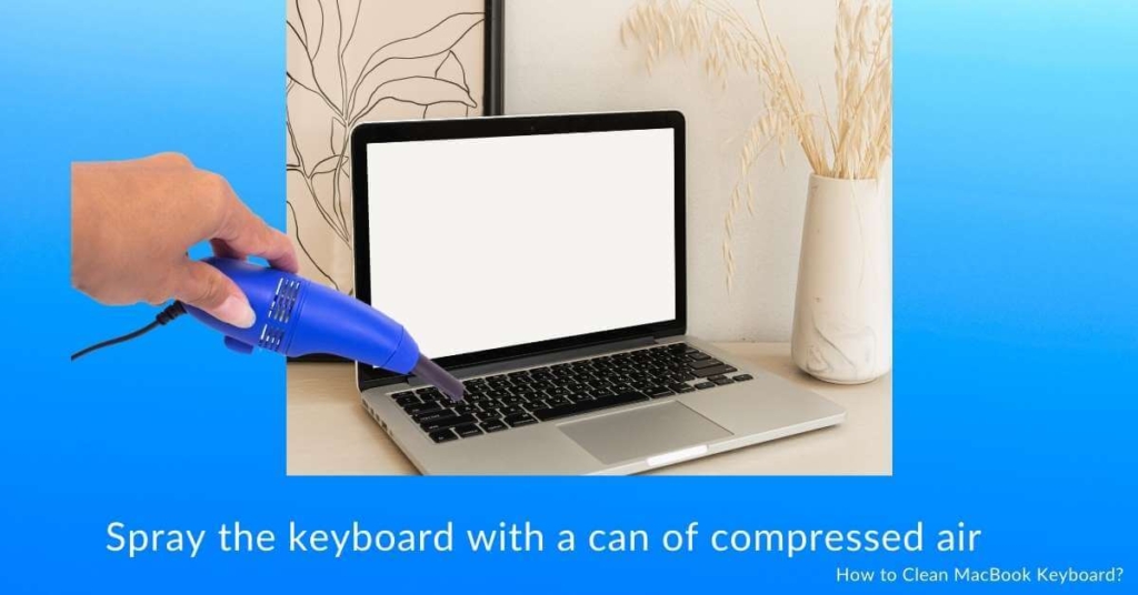 Spray the keyboard with a can of compressed air