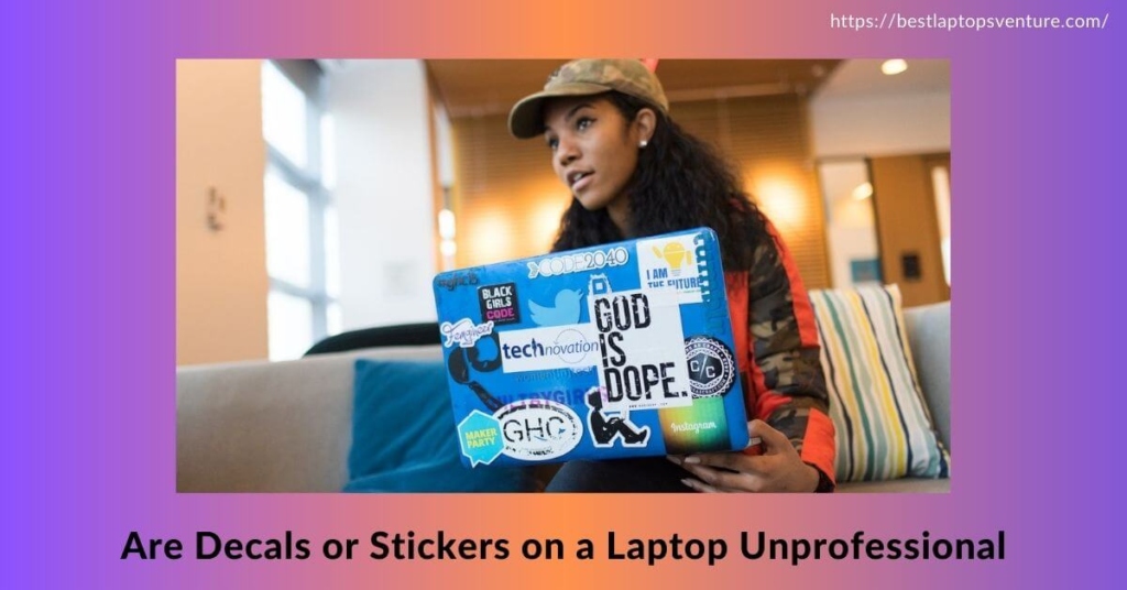 A girl with a laptop which has many stickers.